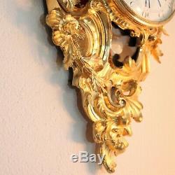 Antique French cartel wall clock of gilt bronze in the Louis XV style