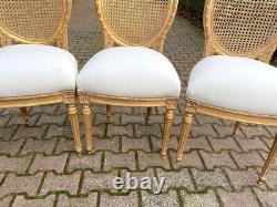 Exquisite Pair of French Louis XVI Cane Back Dining Chairs with Gold Leaf Finish