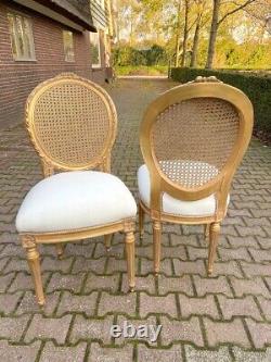 Exquisite Pair of French Louis XVI Cane Back Dining Chairs with Gold Leaf Finish