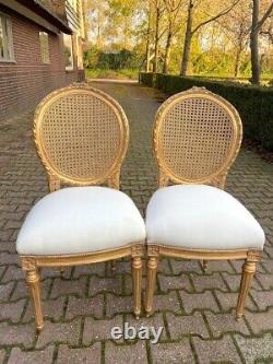 Exquisite Pair of French Louis XVI Cane Back Dining Chairs with Gold Leaf Finish