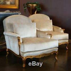 French Louis XV oversized Arm Chairs in antiqued gold leaf white velvet