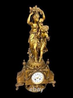French Louis XVI style table / mantle clock in gilded alloy. Made 19th century