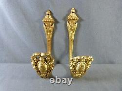 Pair of french gilt bronze curtain tiebacks in Louis XVI style late 19th century