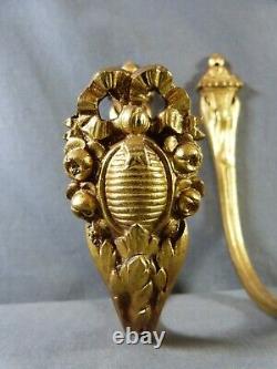 Pair of french gilt bronze curtain tiebacks in Louis XVI style late 19th century